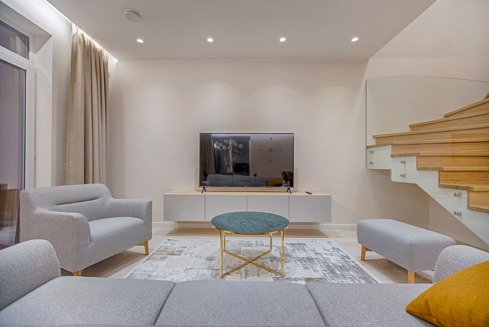 A freshly painted, bright modern living room with crisp clean walls and trim